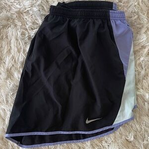 Nike Dri-Fit women’s running/workout shorts. Color: Purple and Black